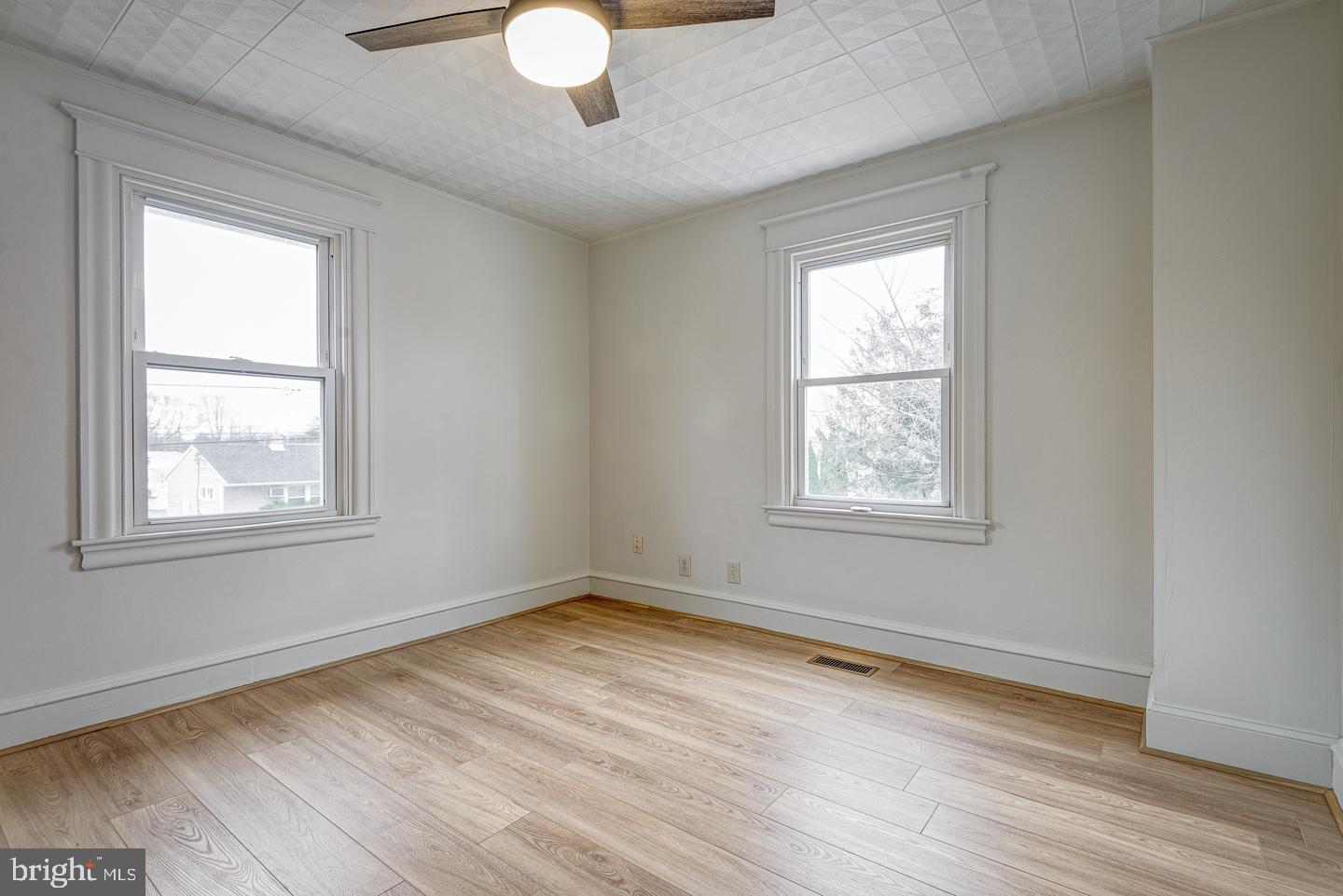 1363 Maple Avenue Croydon, PA 19021 - Photo 20 of 29 a view of an empty room with wooden floor and a window