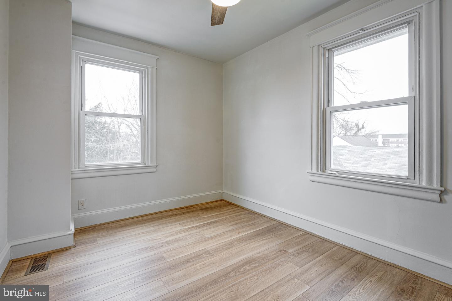 1363 Maple Avenue Croydon, PA 19021 - Photo 21 of 29 an empty room with wooden floor and windows