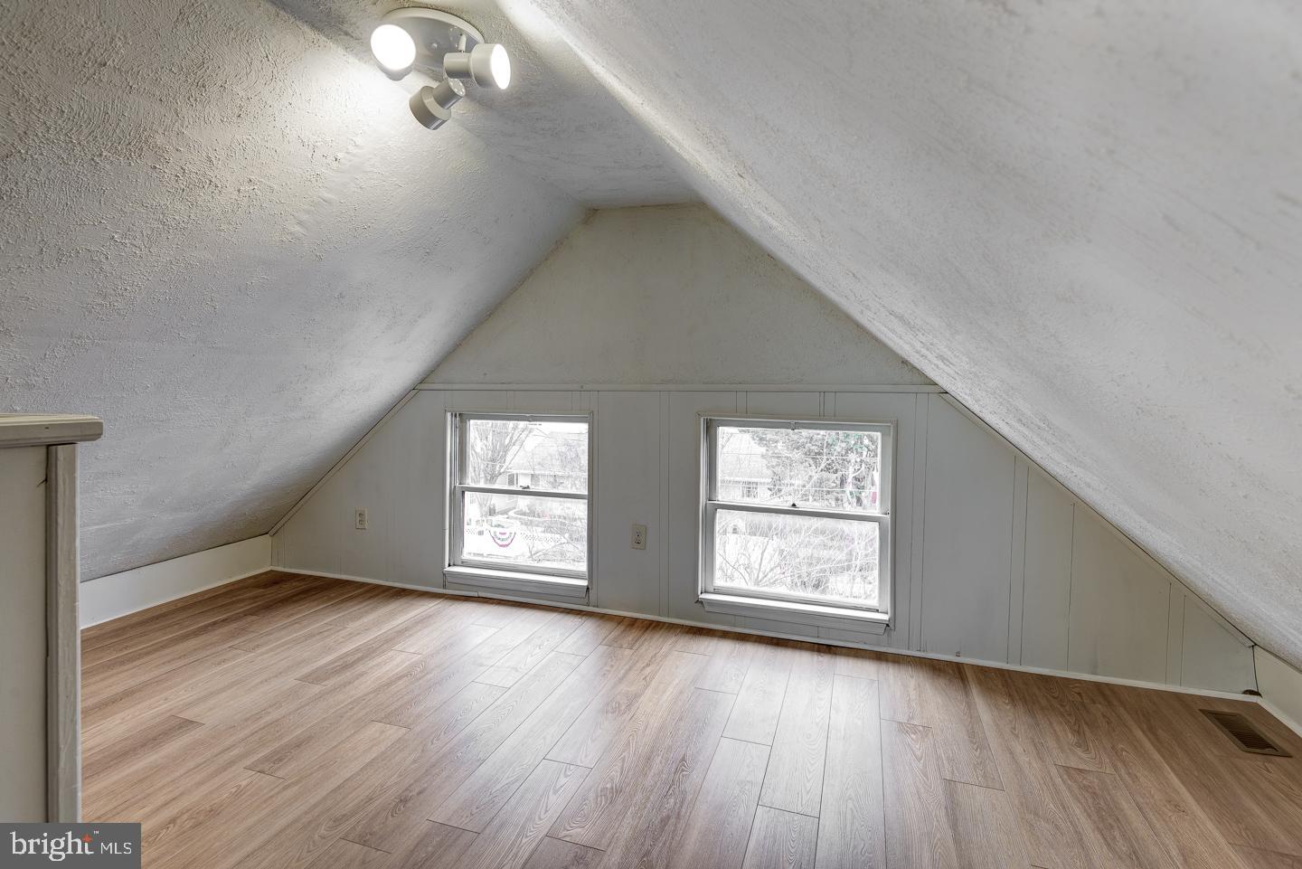 1363 Maple Avenue Croydon, PA 19021 - Photo 22 of 29 an empty room with wooden floor and windows