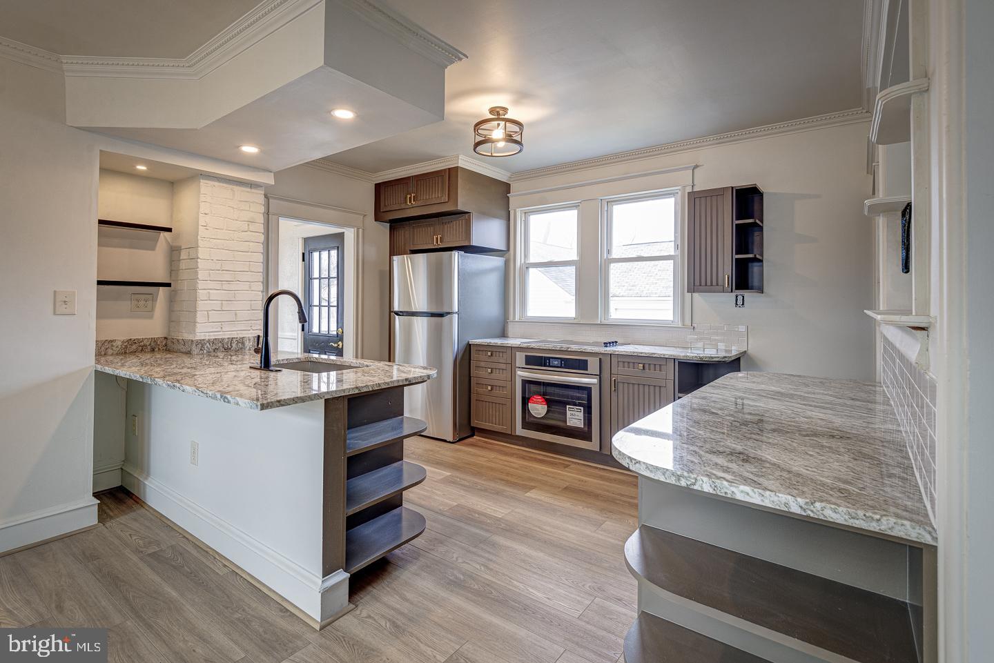 1363 Maple Avenue Croydon, PA 19021 - Photo 10 of 29 a kitchen with kitchen island granite countertop a stove and a sink