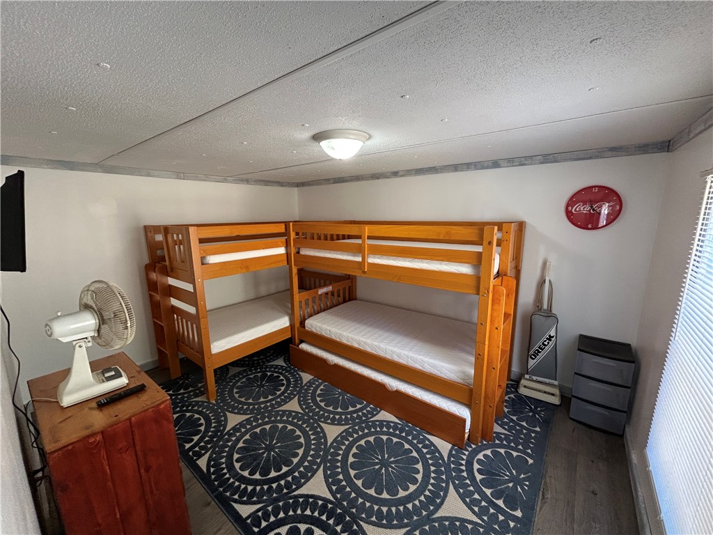43 Sunset Cove Road Abbeville, SC 29620 - Photo 14 of 41 This cozy bedroom provides comfortable accommodations with ample sleeping arrangements and durable flooring.