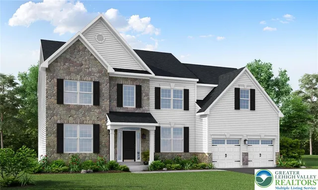 a view of a white house next to a yard