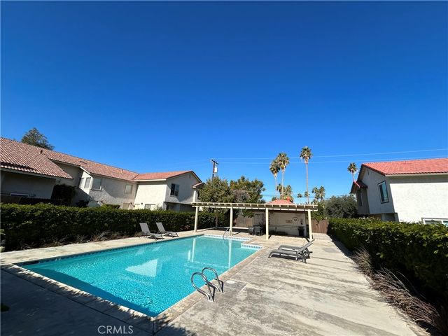 a view of a swimming pool with a patio