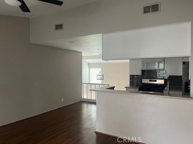 a kitchen with sink and cabinets