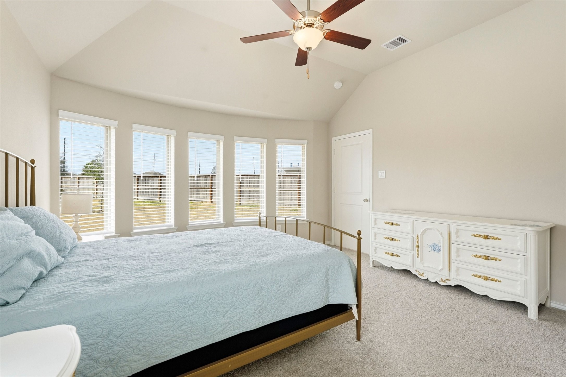 10526 Cabot Trail Rosharon, TX 77583 - Photo 12 of 24 a bedroom with a bed and a chandelier