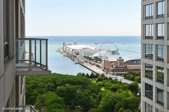 a balcony with a yard and potted plants