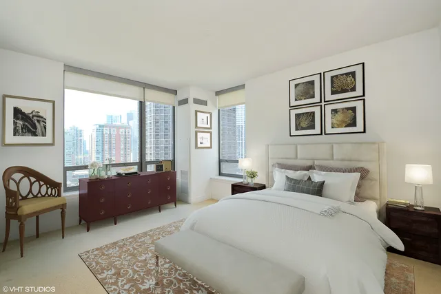 a bedroom with a bed and glass window