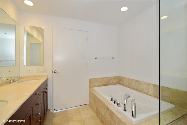 a bathroom with a bathtub and a sink