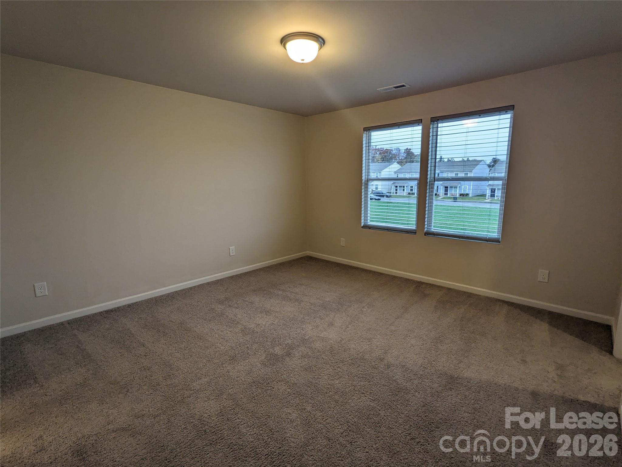 237 Century Drive Salisbury, NC 28147 - Photo 4 of 9 an empty room with windows
