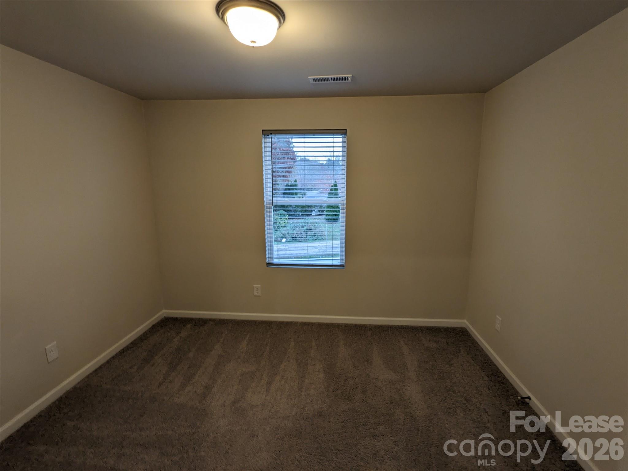 237 Century Drive Salisbury, NC 28147 - Photo 6 of 9 an empty room with a bench