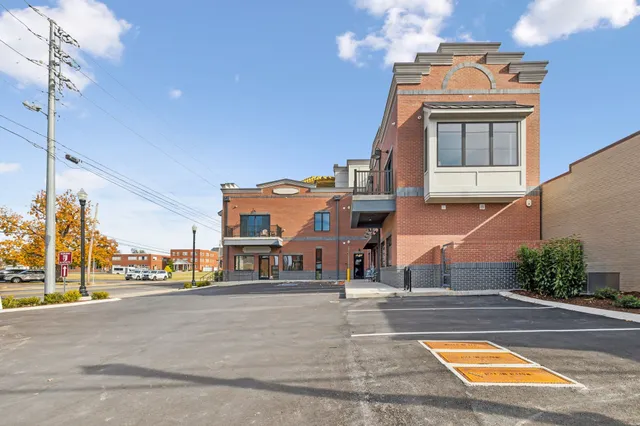 a view of houses with a street