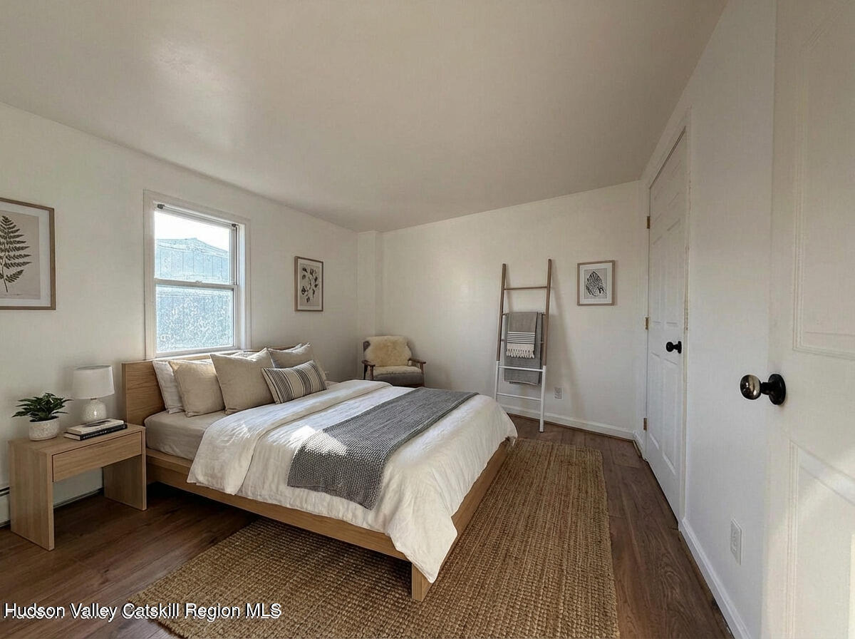 4 Frederick Street Hudson, NY 12534 - Photo 11 of 14 a bedroom with bed and a window
