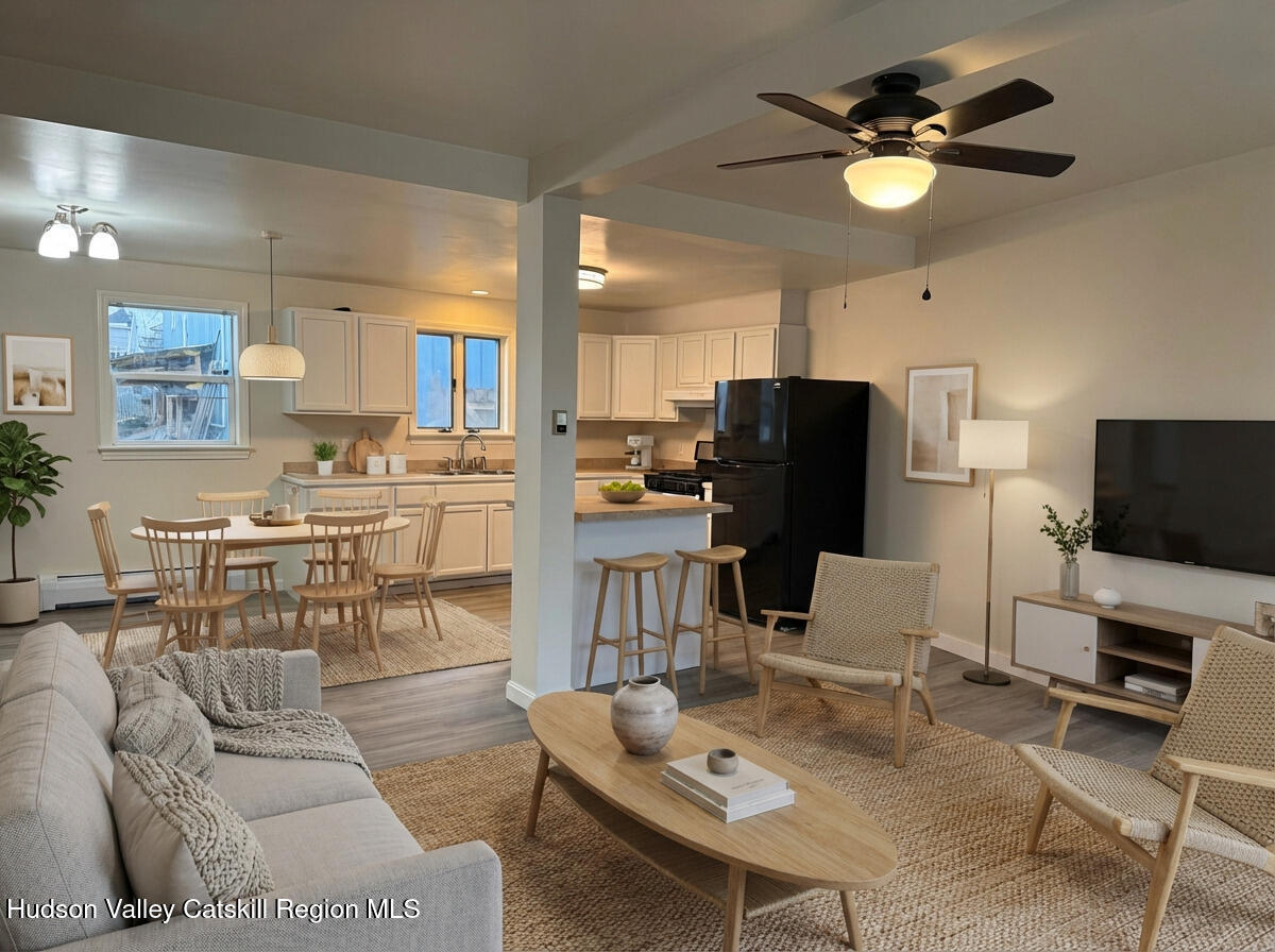 4 Frederick Street Hudson, NY 12534 - Photo 2 of 14 a living room with furniture and a flat screen tv