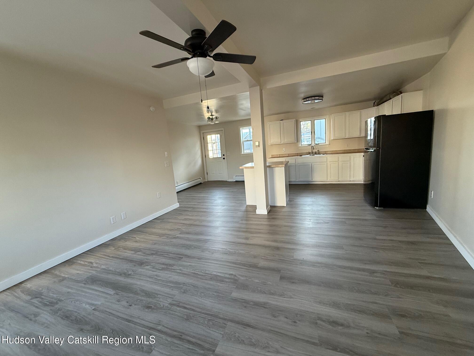 4 Frederick Street Hudson, NY 12534 - Photo 4 of 14 a view of empty room with wooden floor and window