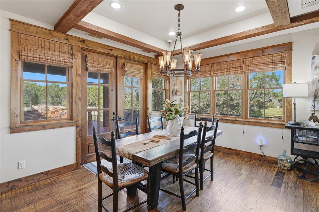 1080 Cascade Lane Graford, TX 76449 - Photo 12 of 39 a view of a dining room with furniture window and wooden floor