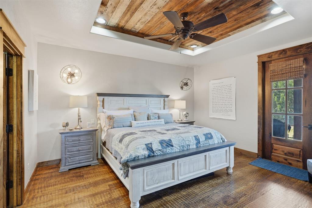 1080 Cascade Lane Graford, TX 76449 - Photo 14 of 39 a bedroom with a bed and a ceiling fan