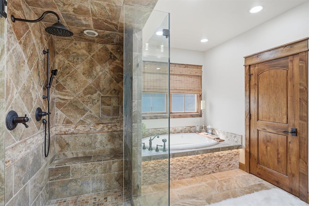 1080 Cascade Lane Graford, TX 76449 - Photo 16 of 39 a bathroom with a granite countertop shower mirror and a sink