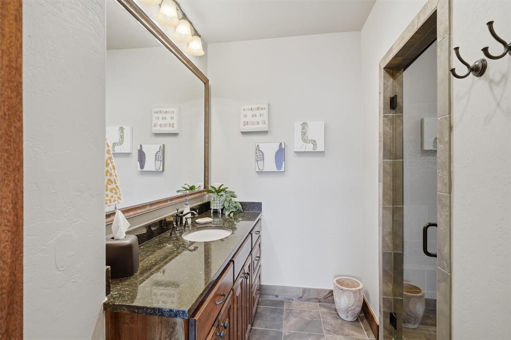 1080 Cascade Lane Graford, TX 76449 - Photo 24 of 39 a bathroom with a sink toilet and shower