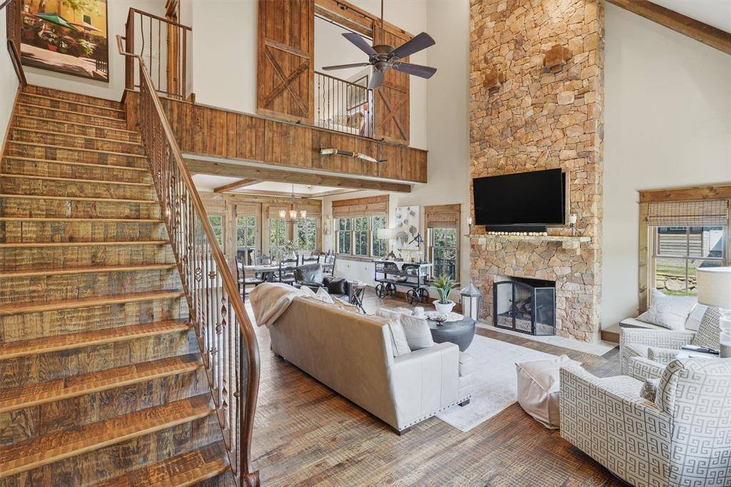 1080 Cascade Lane Graford, TX 76449 - Photo 3 of 39 a living room with furniture a fireplace and a flat screen tv