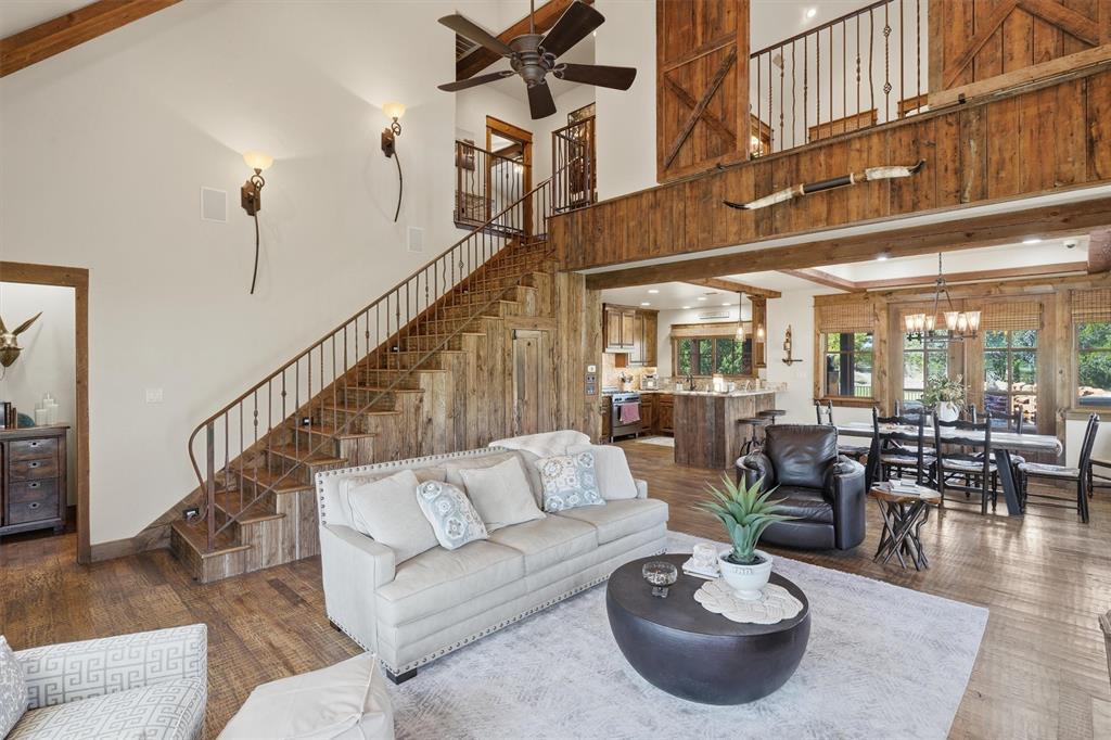 1080 Cascade Lane Graford, TX 76449 - Photo 5 of 39 a living room with furniture and a dining table with wooden floor