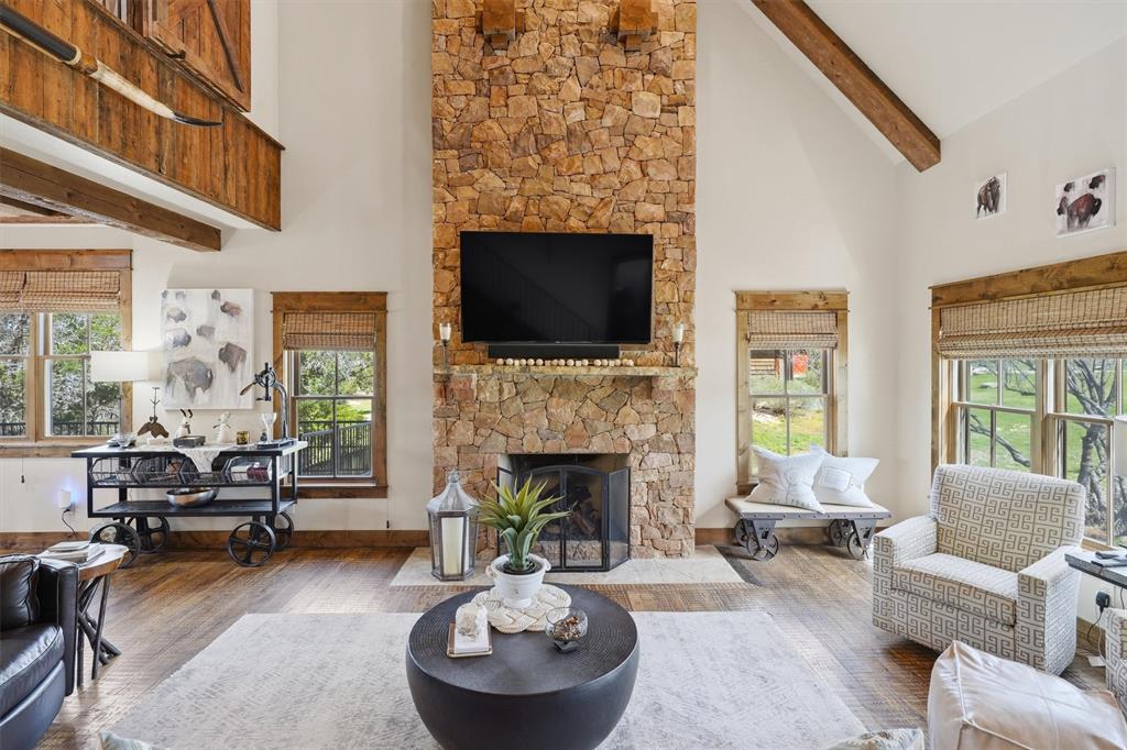 1080 Cascade Lane Graford, TX 76449 - Photo 6 of 39 a living room with furniture a fireplace and a flat screen tv