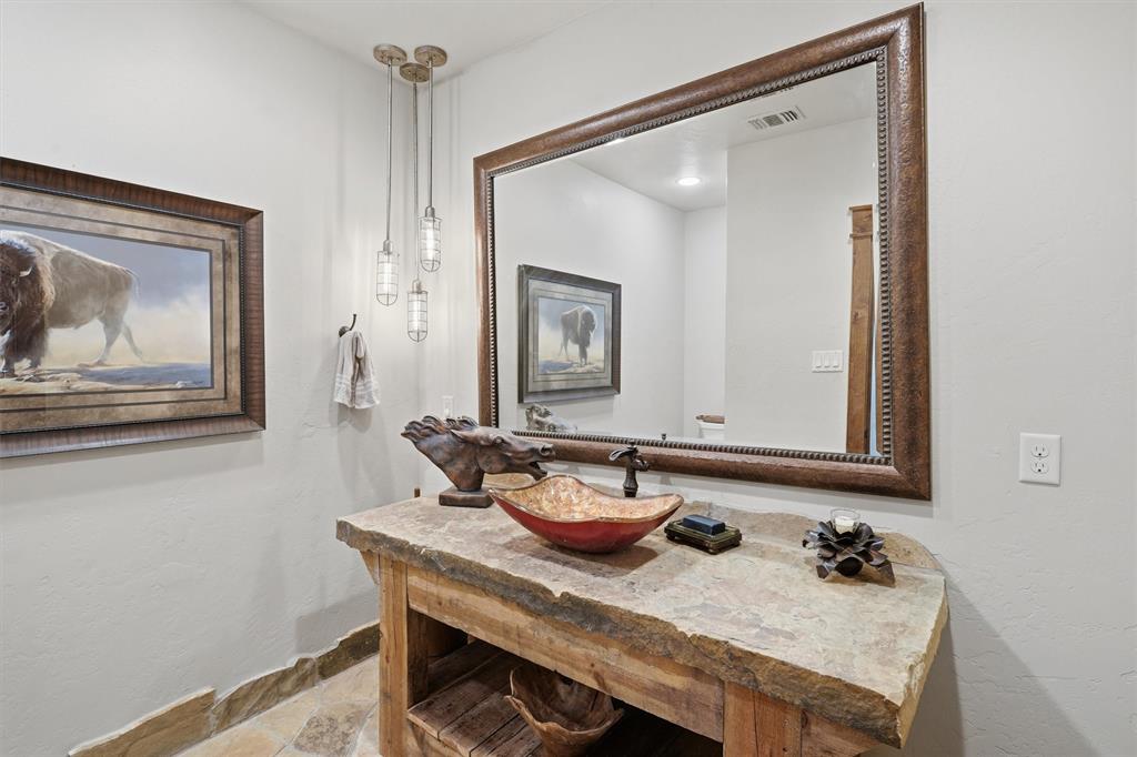 1080 Cascade Lane Graford, TX 76449 - Photo 7 of 39 a bathroom with a sink and a mirror