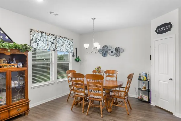 a stove top oven sitting inside of a kitchen