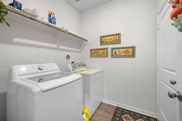 a bathroom with a granite countertop sink a toilet and a mirror