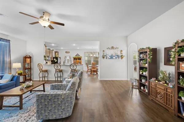 a view of hallway with paintings on the wall