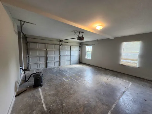 a view of empty room with windows and closet