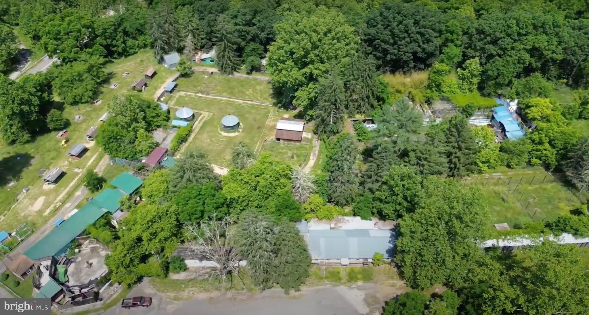 10105 Cottage Inn Lane Northeast Cumberland, MD 21502 - Photo 18 of 20 an aerial view of a house with a yard and garden