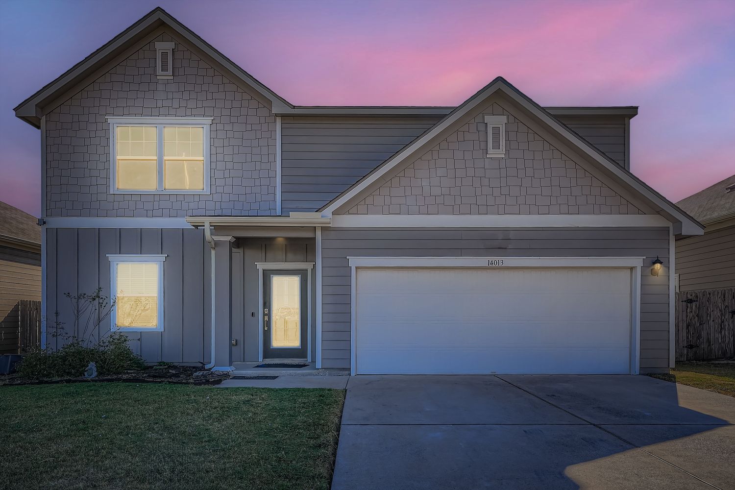 14013 Mark Christopher Way Manor, TX 78653 - Photo 1 of 28 a front view of a house with a yard