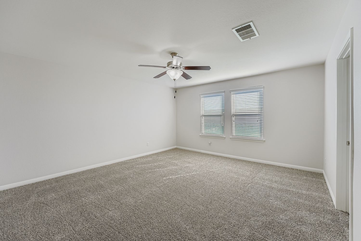 14013 Mark Christopher Way Manor, TX 78653 - Photo 12 of 28 wooden floor in an empty room with a window