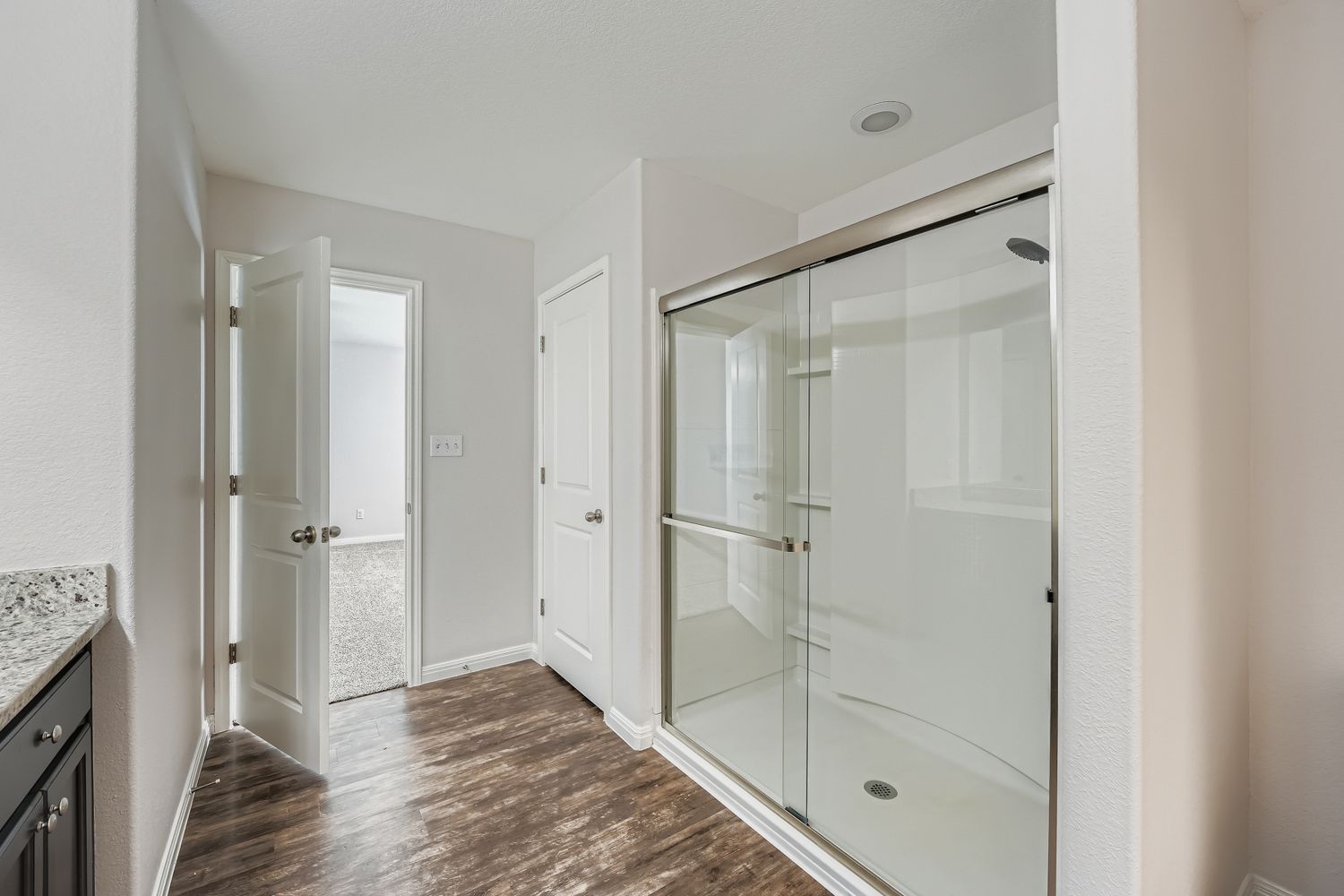 14013 Mark Christopher Way Manor, TX 78653 - Photo 15 of 28 a bathroom with a shower and closet