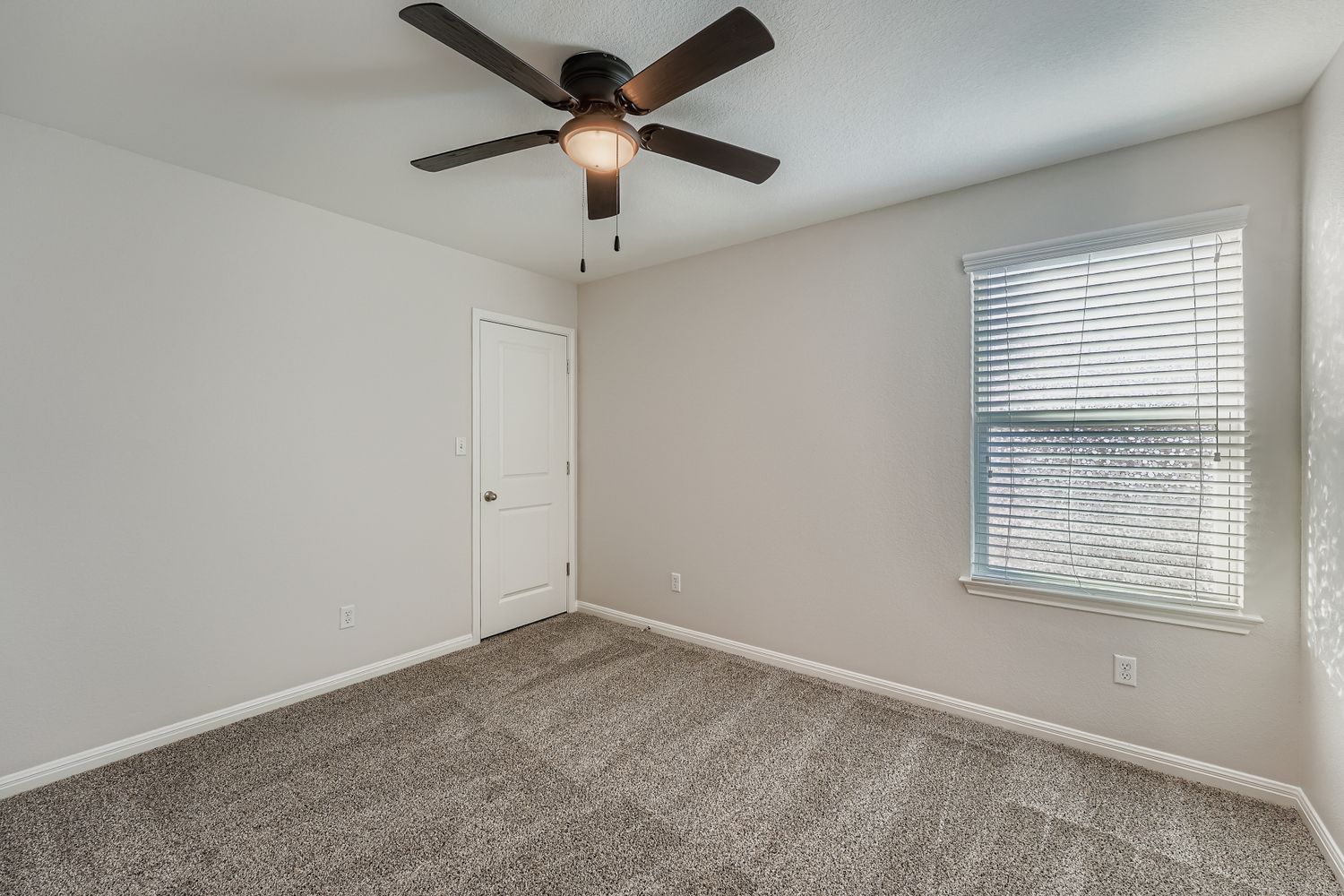 14013 Mark Christopher Way Manor, TX 78653 - Photo 19 of 28 an empty room with a window and a fan