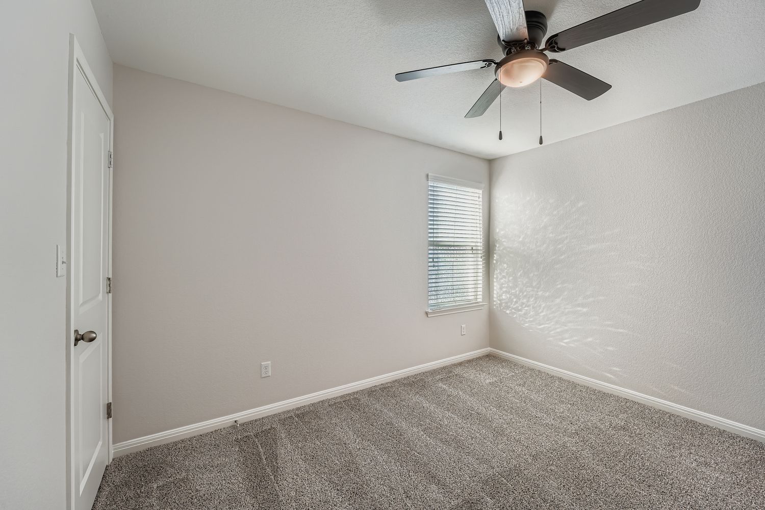 14013 Mark Christopher Way Manor, TX 78653 - Photo 20 of 28 an empty room with a window and a fan
