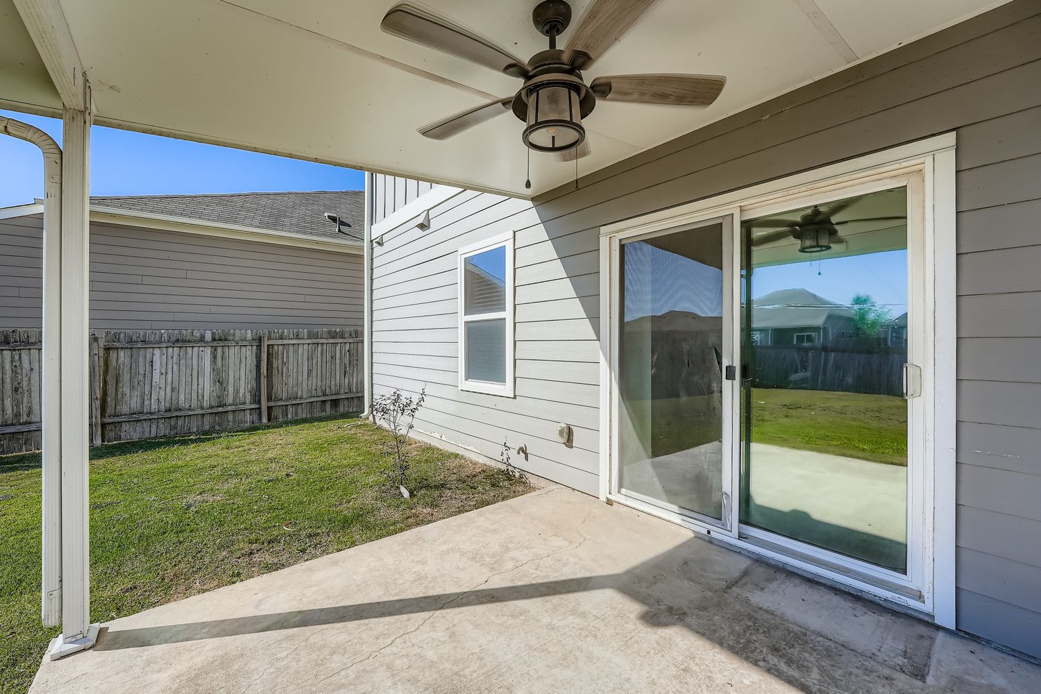 14013 Mark Christopher Way Manor, TX 78653 - Photo 23 of 28 a view of a porch with a table and chairs
