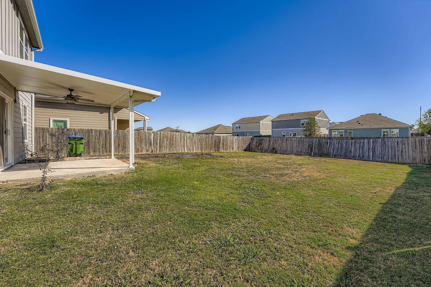 14013 Mark Christopher Way Manor, TX 78653 - Photo 25 of 28 a view of a house with a backyard