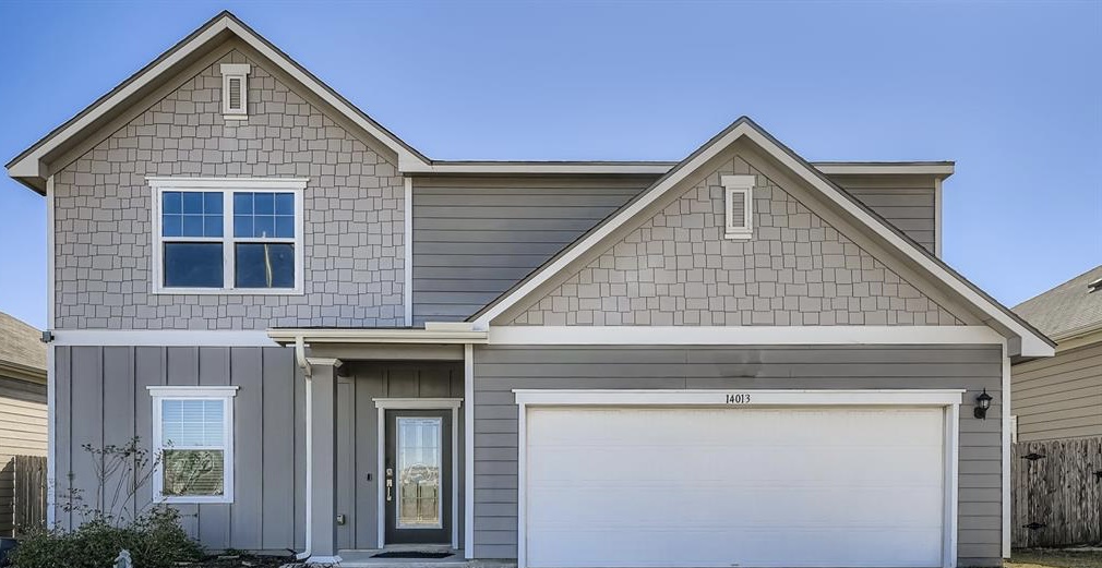 14013 Mark Christopher Way Manor, TX 78653 - Photo 26 of 28 a front view of a house with garage