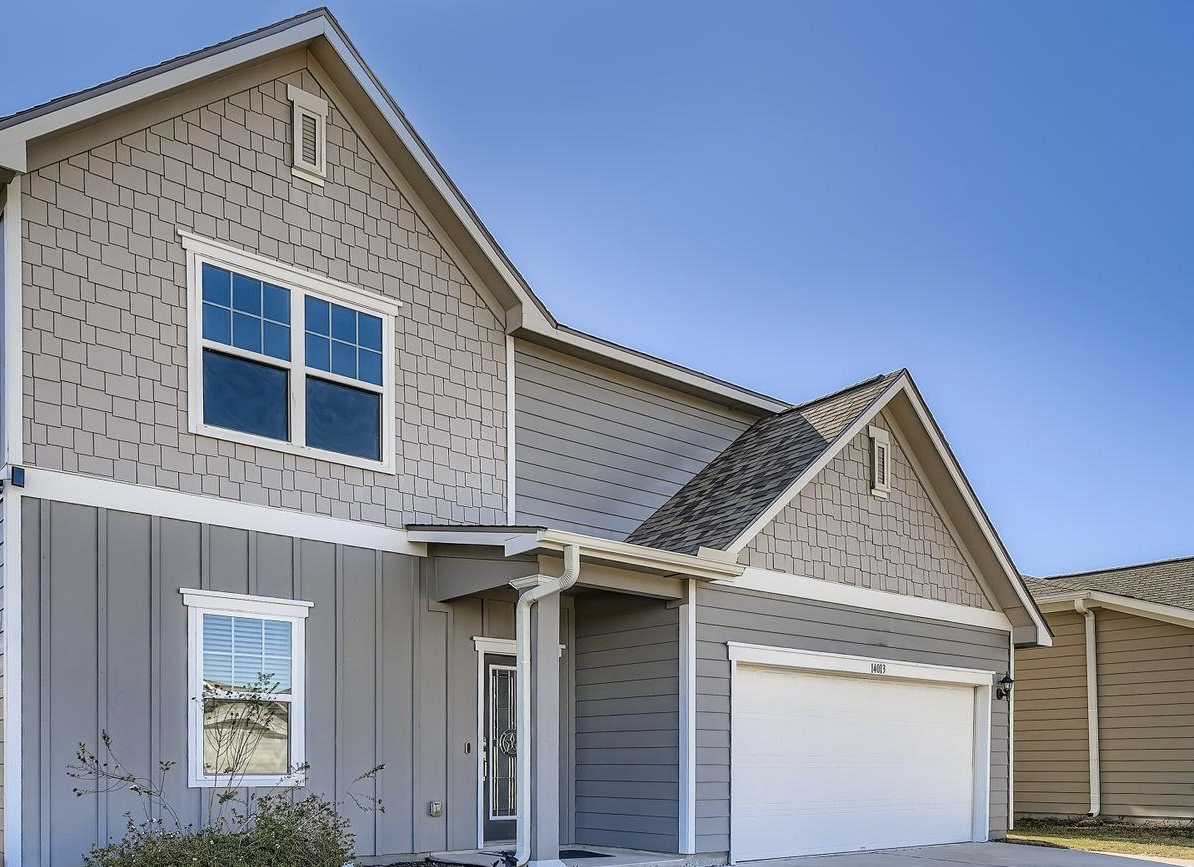 14013 Mark Christopher Way Manor, TX 78653 - Photo 27 of 28 a front view of a house with garage