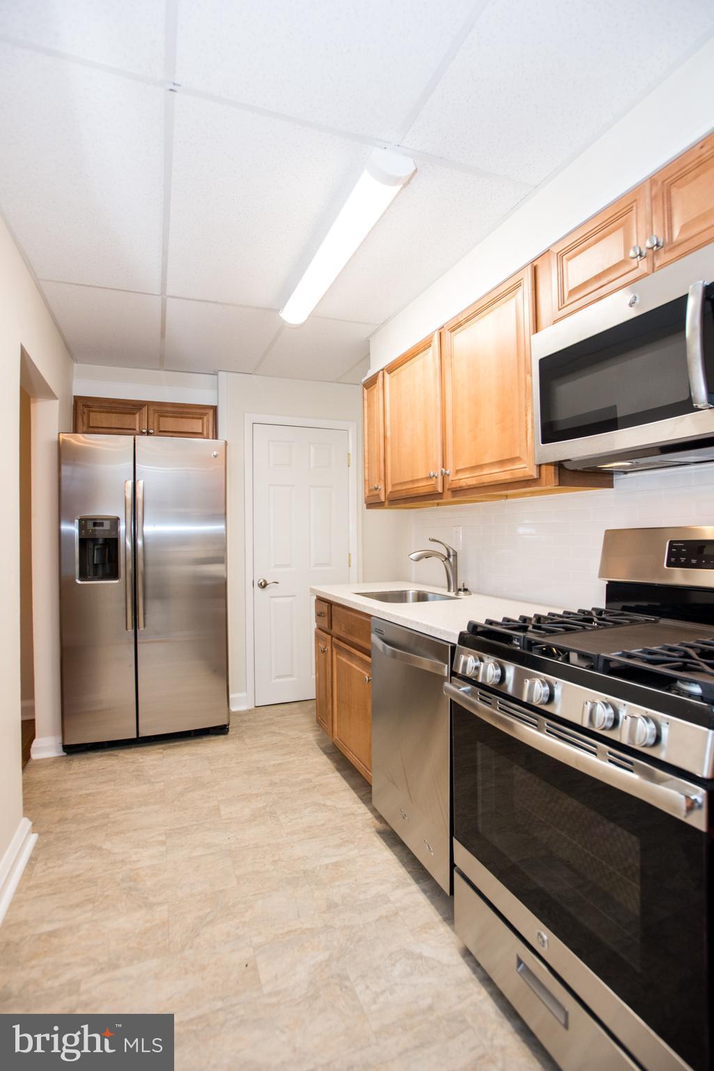 240 Orville Road Baltimore, MD 21221 - Photo 9 of 27 New kitchen/Corian counters/SS appliances