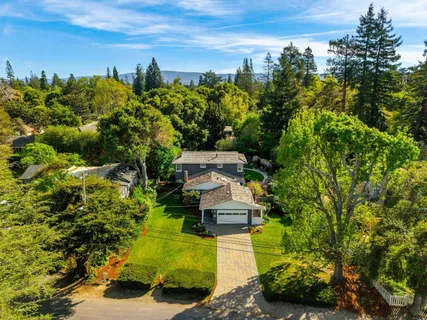 an aerial view of a house with a garden