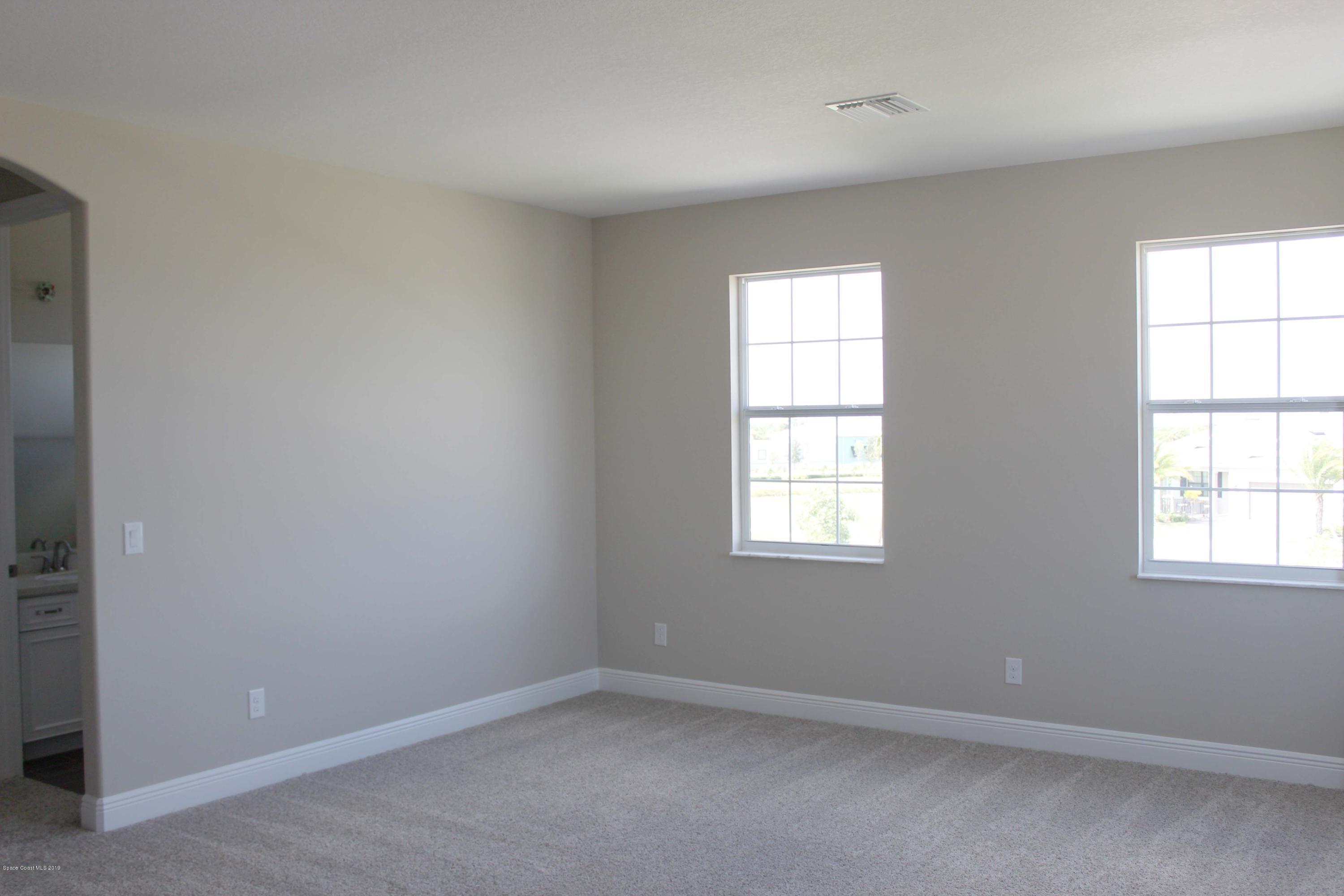 3631 Stabane Place Melbourne, FL 32940 - Photo 13 of 47 an empty room with a window
