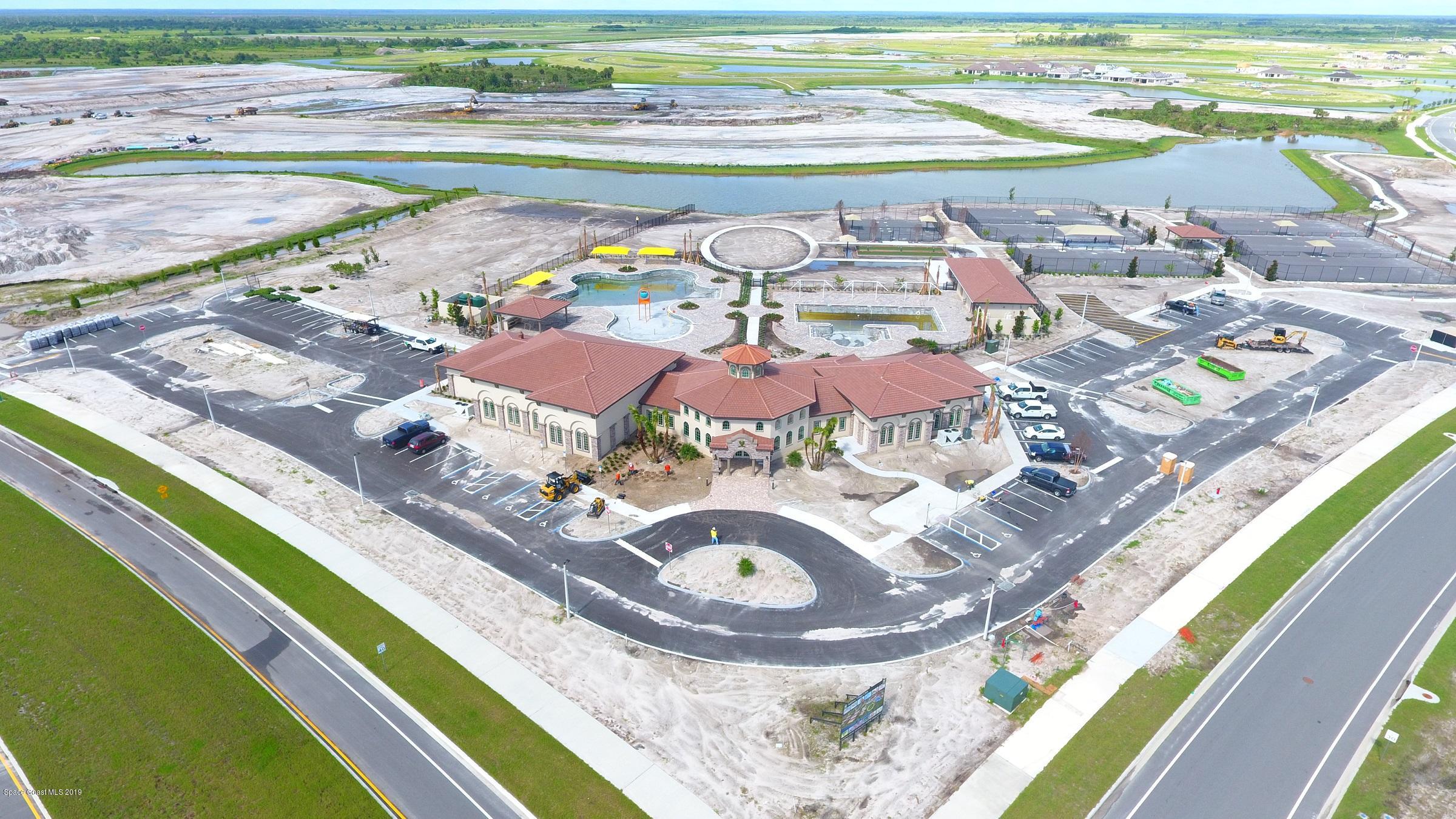 3631 Stabane Place Melbourne, FL 32940 - Photo 25 of 47 a view of a swimming pool with a lounge chairs