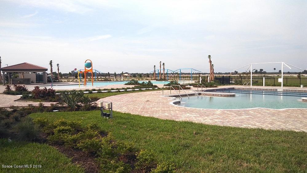 3631 Stabane Place Melbourne, FL 32940 - Photo 30 of 47 a view of a swimming pool with a yard and sitting area