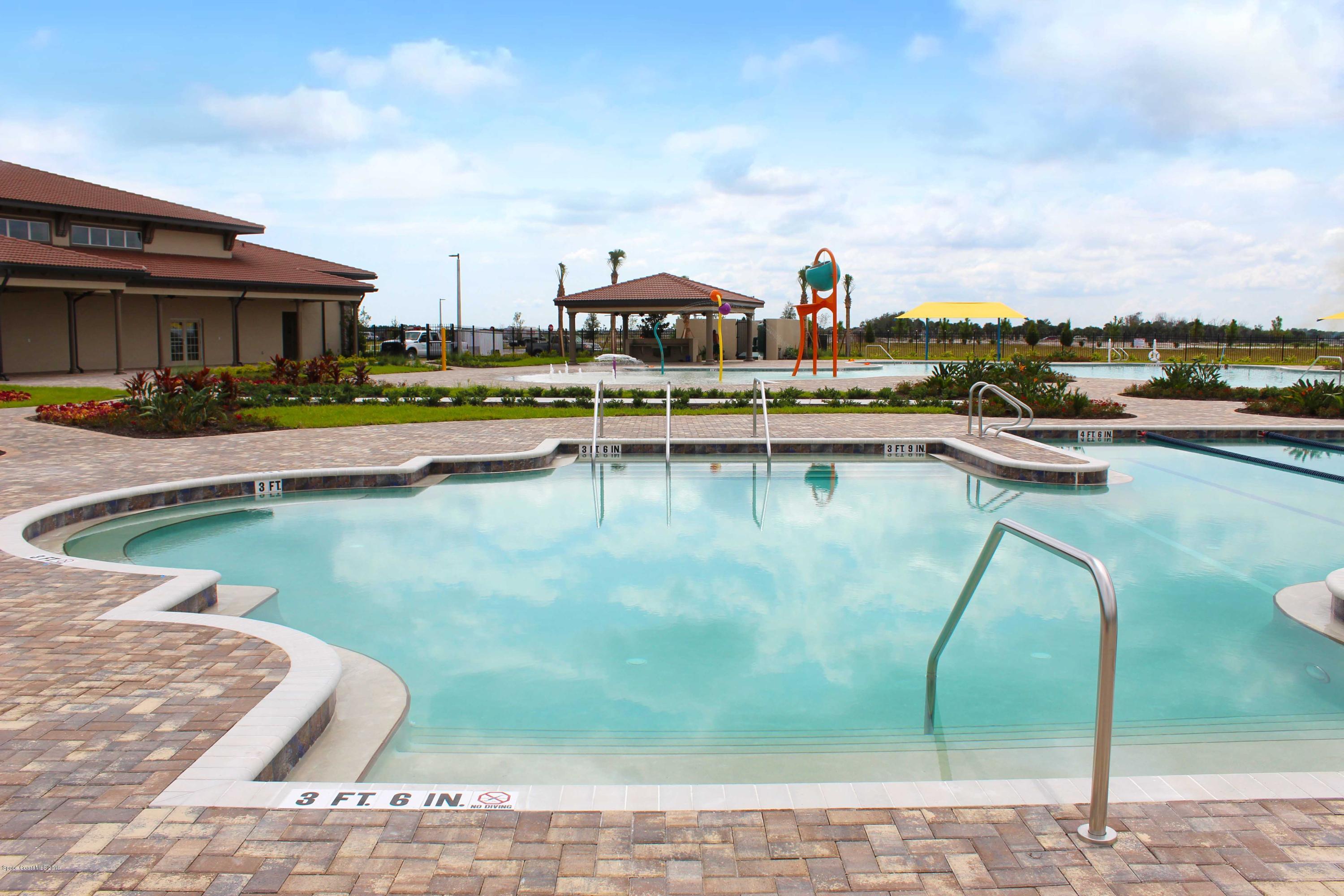 3631 Stabane Place Melbourne, FL 32940 - Photo 46 of 47 a view of a lake with a house