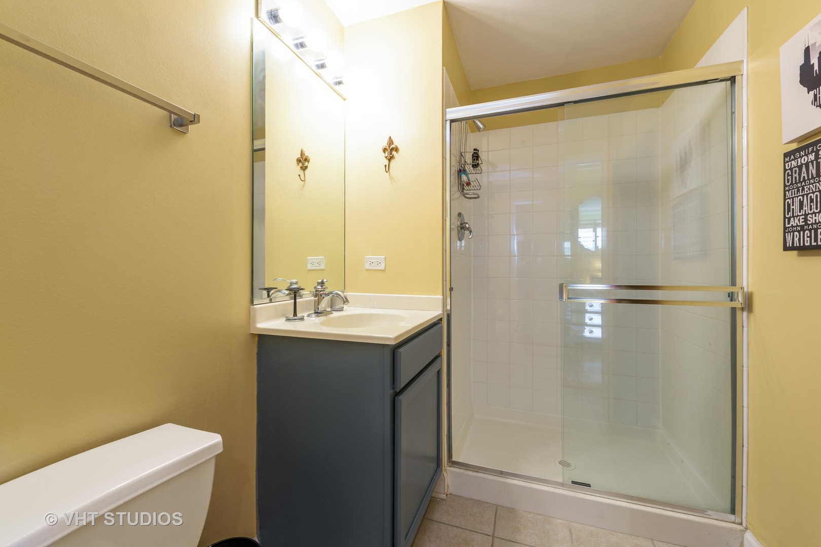 1529 South State Street, Unit 8B Chicago, IL 60605 - Photo 9 of 11 a bathroom with a granite countertop shower mirror and a toilet