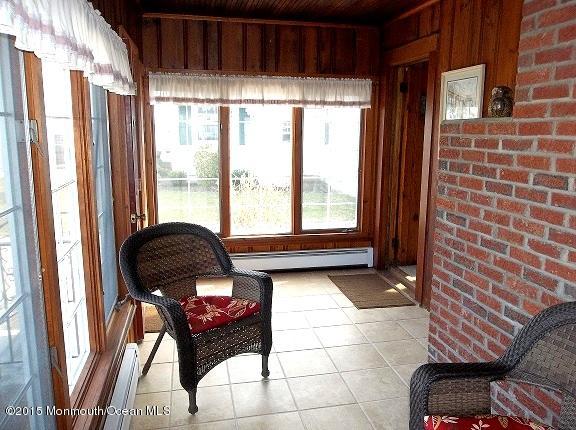 Brigh Airy Enclosed front porch.