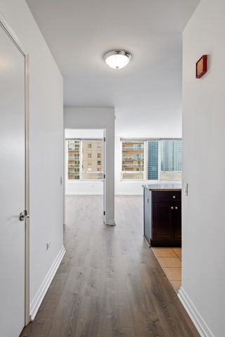 a living room with furniture a rug and a flat screen tv