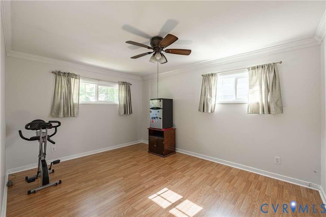 9217 Fisk Road Richmond, VA 23229 - Photo 17 of 39 a view of a room with wooden floor and a ceiling fan